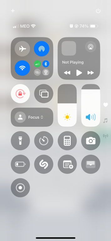 An iPhone Control Center showing various toggles and controls.