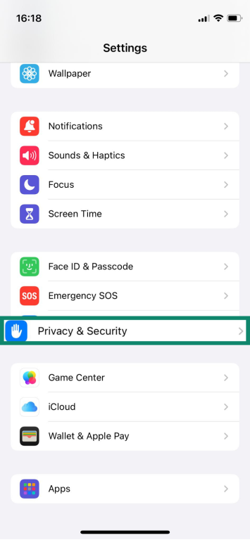 iPhone Settings screen showing how to access Privacy & Security.